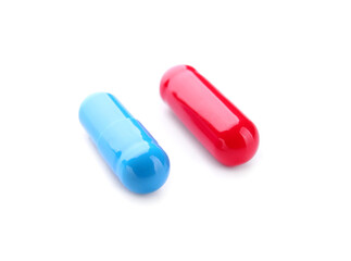 Blue and red pills on white background. Concept of choice