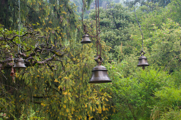 Prayer bells hanging in air at local mountain temple of himachal pradesh