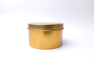 Gold round box on a white background.