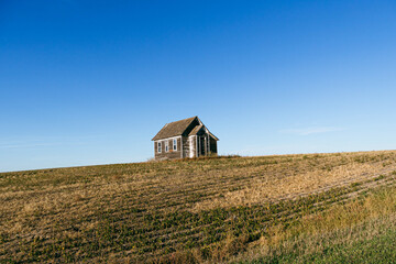 An old country church in the Great Plains during sunset with fall colors