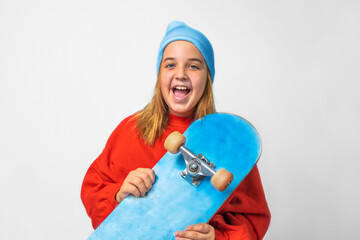 Portrait of a teenage girl in a hat with a skateboard © Vasleriia Kuznetsova
