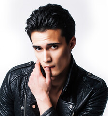 young handsome man, leather jacked on naked torso, emotional posing, white background, modern guy, lifestyle people concept