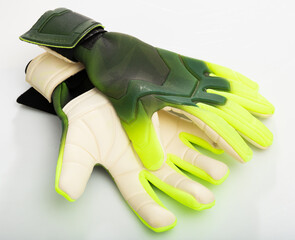 Closeup of pair of goalkeeper gloves isolated on white background. Concept of sports equipment and...