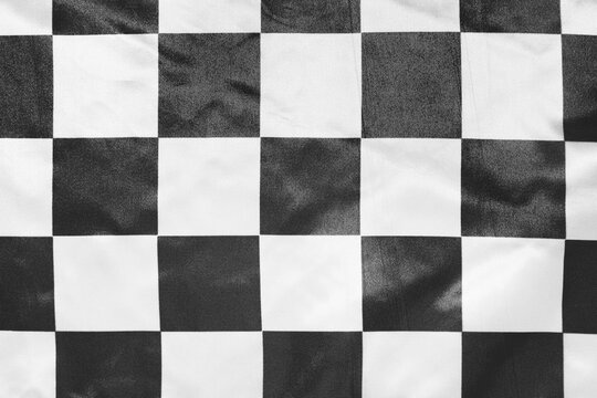 Racing flag as background, closeup view © Pixel-Shot