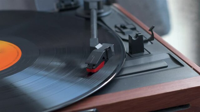 View of old record player playing music from a vinyl record