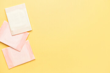 Menstrual pads on yellow background