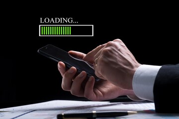 Hands of a man using mobile smartphone for download application and waiting to loading.