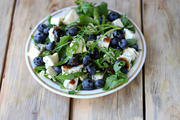 The best salad with blueberries, cheese and arugula.