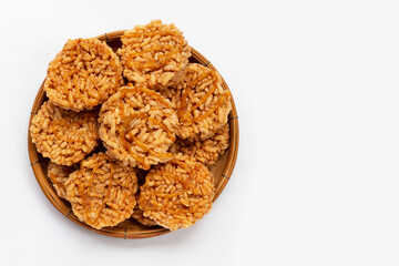 Rice cracker with coconut palm sugar in bamboo basket on white