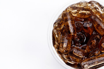 Cola with ice in take away cup on white background.