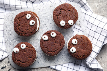 Funny cookies for Halloween on table