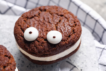 Funny cookie for Halloween on table, closeup