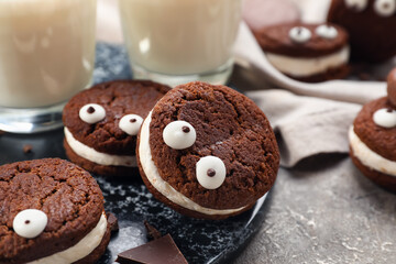 Funny chocolate cookies on table
