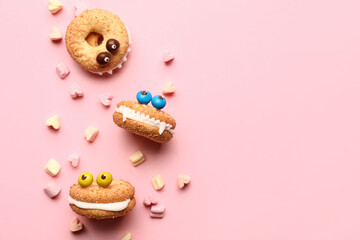 Funny cookies with marshmallows on color background