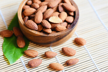 Almonds nuts on wooden bowl, Close up roasted almond nuts natural protein food and for snack