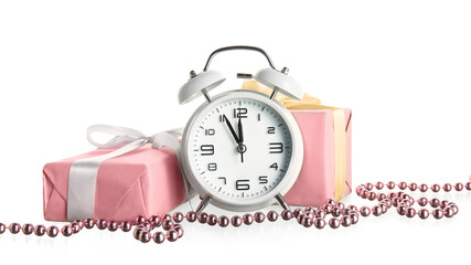 Fototapeta na wymiar Stylish alarm clock, gift boxes and Christmas decor on white background