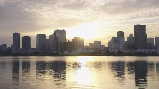 Osaka, Japan. City Reflecting on Yodogawa River at Sunrise