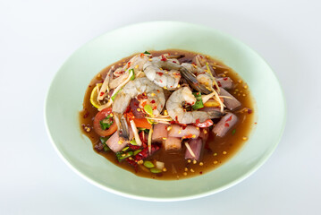Spicy sea food  papaya salad “somtum“ Thai traditional. food on White background