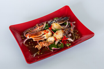 Spicy sea food  papaya salad “somtum“ Thai traditional. food on White background