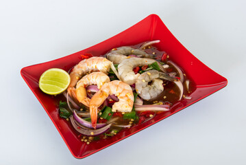 Spicy sea food  papaya salad “somtum“ Thai traditional. food on White background