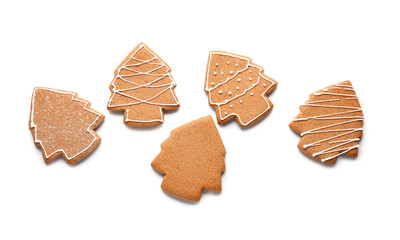 Tasty gingerbread cookies in shape of Christmas trees on white background