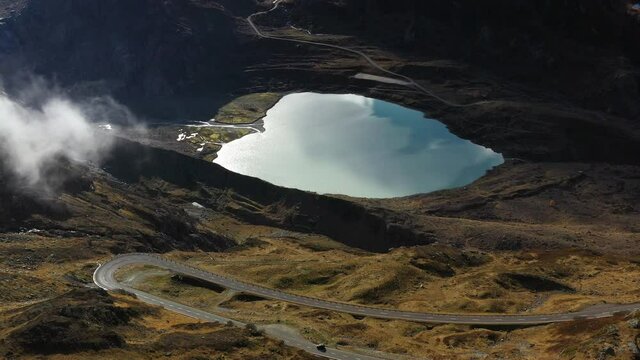Cinematic rotating drone shot of the Steinsee Lake along the Susten Pass, Switzerland
