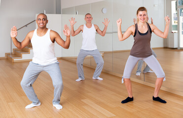 Group of multinational activity people practicing dance techniques