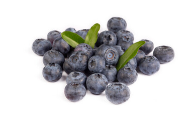 Fresh blueberries with bluberry leaves isolated on white background.