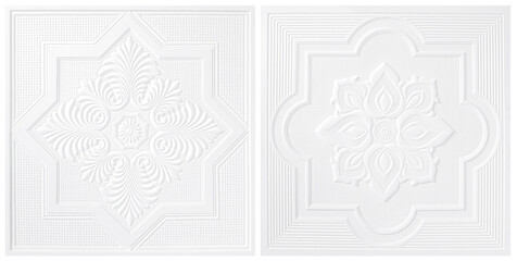 White Patterns on the ceiling gypsum sheets two style of white flowers  isolated  on white...