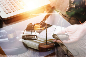 Business and lawyers discussing contract papers with brass scale on desk in office. Law, legal services, advice, justice and law concept picture with film grain effect