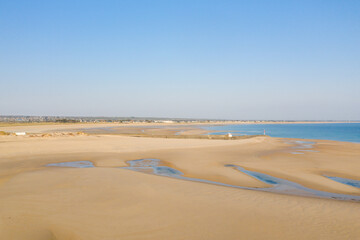 Fototapeta na wymiar The fine sandy beach of La Potiniere in Europe, France, Normandy, Manche, in spring, on a sunny day.