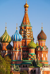 Fototapeta na wymiar St. Basil's Cathedral on Red Square in Moscow on blue sky background.