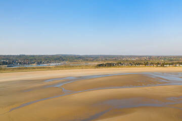 The large fine sandy beach of Barneville in Europe, France, Normandy, Manche, in spring, on a sunny day.