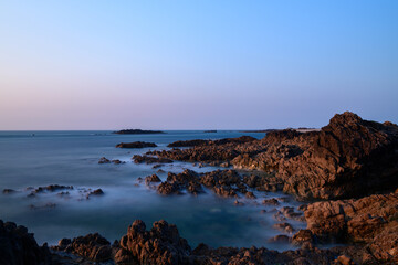 The rocks at the edge of the Channel Sea in Europe, France, Normandy, Manche, in spring, on a sunny day.