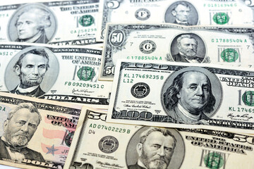 selective focus of a background of American money banknotes of different values and times, Variety...