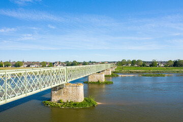 The old railway bridge in the town of Sully sur Loire in Europe, France, Center region, Loiret, in summer on a sunny day.