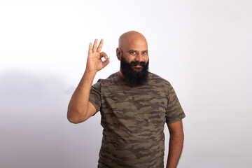 Naklejka premium Happy Indian Healthy middle aged man Showing okay gesture with hand