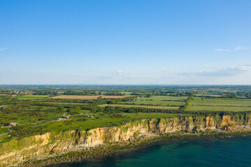 Fototapeta na wymiar The Norman bocage near the Pointe du Hoc in Europe, France, Normandy, towards Carentan, in spring, on a sunny day.
