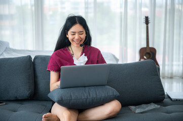 Asian woman Teenager in feeling of happy and smiling lifestyle while relax in living room at home