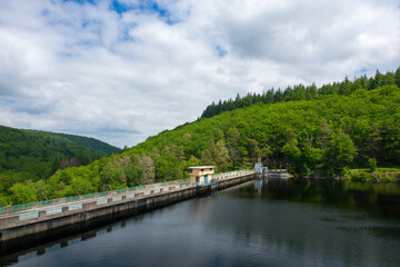 Fototapeta premium The Lac de Chaumecon dam in the middle of the countryside and forests in Europe, France, Burgundy, Nievre, Morvan, in summer, on a sunny day.