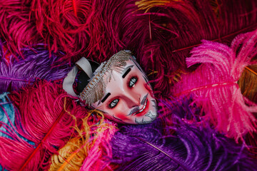 Mexican Carnival mask for traditional parade on colorful bird feathers in Mexico Latin America

