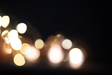 Blurred Christmas lights over dark blue background