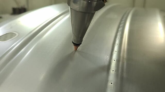 Laser Cutting In Progress Using A 5-axis Laser Cutting Machinery. close up