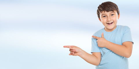 Child kid little boy showing with finger pointing on ad advertising with copyspace copy space