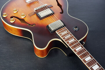Fototapeta na wymiar Jazz electric guitar on a black background. Close-up.