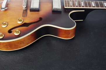 Obraz na płótnie Canvas Jazz electric guitar on a black background. Close-up.