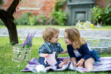 Obraz premium Children on pirnic. Baby child on the green grass in summer park.