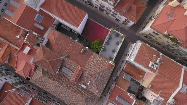 Birdseye aerial view over Bairro Alto in Lisbon Portugal showing the Rooftops and streets of the residential area.