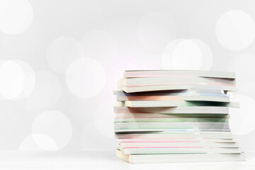 books on reading table with white bokeh background. concept of learning and education
