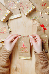 Advent calendar on a wooden background with a place to write